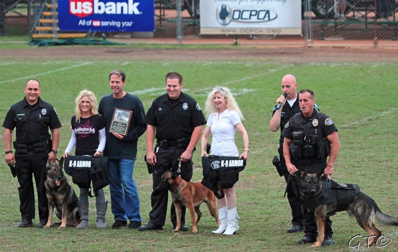 Orange PD Officer Gutierrez with K9 Lycan, Krista and Mike Pennington who generously donated for six vests, Fullerton PD Officer Miller with K9 Mueller, K-9 Armor Co-Founder Suzanne Saunders, OCPCA Pres. Bob Smith and Huntington Beach PD Officer Ricci with K9 Xavi.