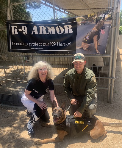 Smiles from Suzanne Saunders, K9 Armor cofounder and Riverside Sheriff  K9 Storm and Deputy Giallorenzo