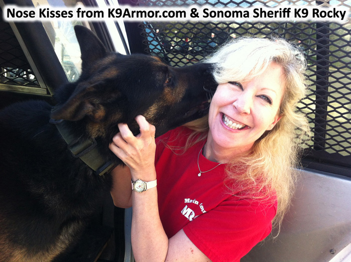 Nose kisses from Sonoma County Sheriff K9 Rocky and Suzanne Saunders giving Rocky a K9 Armor vest. Photo by Deputy Mason