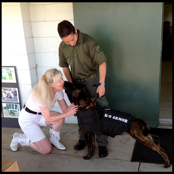 Stanislaus County Sheriff K9 Sam gives K9 Kisses to Suzanne Saunders, K9 Armor Co-Founder